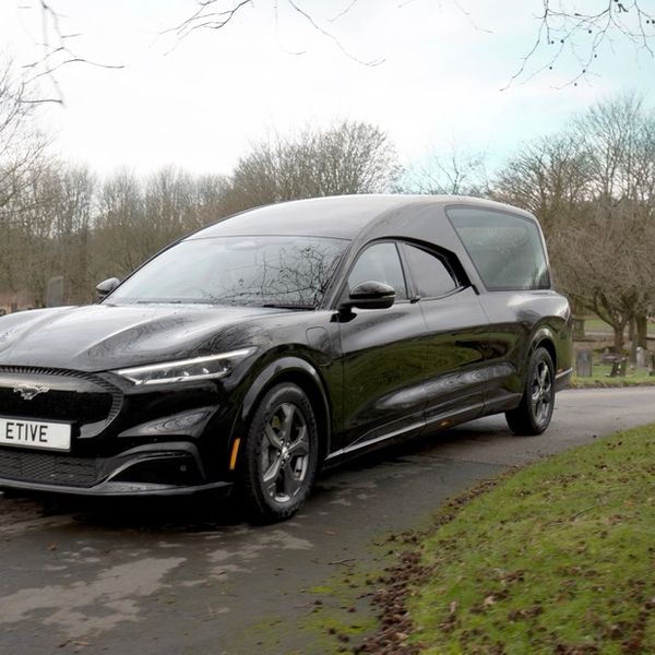 Ford Mach e hearse front three quarter shot, in graveyard